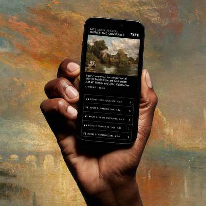A hand holds a phone showing the Tate Story Player for the Turner and Constable exhibition, with audio guide tracks listed on the screen.